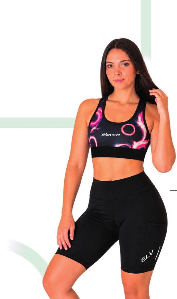 Top deportivo running mujer Negro Círculos Fucsia 50579 – Entre Rutas